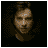 Animated sequence of a person with dark hair against black background, showing hand gestures near mouth and shifting facial expressions.