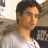 A pixelated image of a person in a white shirt on the left, next to green text reading 'Original Icons .com' on a dark background.