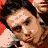 A 6-frame animated contact sheet showing multiple pixelated faces of a man with dark hair against a red background, including one bald frame and visible text "Coolbuddy.com" on the right side.