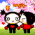 Two cartoon characters stand under pink cherry blossoms; one winks while holding a red heart, the other holds a yellow object with hearts floating around them.
