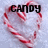 A heart-shaped arrangement of red and white striped candy canes with overlaid text reading 'CANDY', 'CANE', and 'CUTIE!'