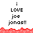 Pixelated text reads "i LOVE joe jonas!!" in three above a red wave pattern, with two of identical text below the wave