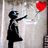 Pixelated image of a girl reaching for a red heart-shaped balloon with text in red pixelated font on black background.