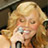 Static 48x48 pixel icon of a person with blonde hair holding a microphone, rendered in low-resolution pixel art style with visible dithering and color blending.