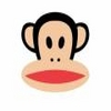 Pixelated monkey face with black hair, large ears, dark oval eyes, small black nose dots, and a wide red mouth on a light skin tone face.
