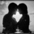 Black-and-white pixelated image of two figures embracing with a bright star symbol between them, accompanied by red text on a light background.