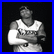 A pixelated grayscale image of a basketball player in a white jersey with crossed arms, next to blue text reading "LUV #3" on black background.