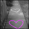 A black-and-white sidewalk scene with chalk hearts, overlaid with changing colored text and heart symbols across six
