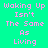 Pixelated text on a bright green background with alternating light purple and solid green sections displaying the phrase "Waking Up Isn't The Same As Living" in pink lettering.