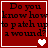 Red background with black text reading "Do you know how to patch up a wound?" and white heart symbols changing from single to double to two separate hearts.