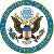 Pixelated circular seal featuring a bald eagle with outstretched wings, holding olive branches and arrows, surrounded by a blue-and-yellow border.