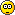 Nine pixelated yellow circular faces with black outlines arranged in a , each displaying distinct eye and mouth configurations against a gray background