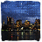 Cityscape at night with illuminated buildings reflected in water, stars moving across a blue sky.