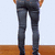 A person wearing dark gray jeans stands with hands in pockets against a light background, paired with text overlays on colored backgrounds.