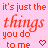 A static image with a light pink background displays repeated red text reading "it's just the things you do to me" alongside small pixelated heart symbols.