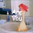 A static image of a red-haired figure in a beige dress standing in a bathroom sink, with text reading "Are You" and "Chicken?" visible in different frames.