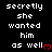 Pixelated text repeats 'secretly she wanted him as well' with red heart symbols on a black background, displayed in a