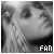 Black-and-white pixelated image of a person with long hair, showing text 'FAN OF CHRISTINA' in blocky font across three