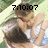 Pixelated image of two figures in close physical contact with overlaid digital time display.