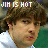 Pixelated image of a person with brown curly hair wearing white and green clothing, text above reads "JIM IS HOT" in red and multicolored letters.