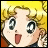 Pixelated anime-style character with blonde hair and wide eyes, mouth open in surprise, next to stylized text on black background.