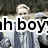 Pixelated image of a person with light hair wearing a gray jacket and dark pants, overlaid with partial black text reading 'h boy' on white background.