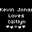 Pixelated text displays 'Kevin Jonas Loves Caitlyn' with four heart symbols below, two white and two gray on a black background.