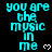 Cyan pixelated text "you are the music in me" repeated vertically with white heart symbols on black background, some instances have gray rectangular overlay.