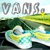 A static image shows a pair of Vans sneakers on a road with a grassy hill and sky background, featuring large 'VANS' text at the top.
