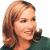 A pixelated image of a person with light brown hair and a dark top, next to green text on a dark background.