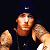A pixelated contact sheet showing two frames of an animated icon featuring a person with tattoos and a dark cap on the left, next to green text reading "Original Icons .com" on a solid green background.