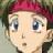Pixelated close-up of a character with light skin, blue eyes, and a red headband, set against a blurred green background.