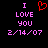 Pixelated text and symbols on black background: 'I' above 'LOVE' above 'YOU' above '2/14/07' in pink, with red heart symbol above 'I' on left side.