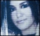 Five of a blue-toned animated image showing two people with changing facial expressions and slight head movements
