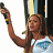 A pixelated contact sheet showing two frames of an animated icon featuring a woman holding a microphone on the left and green text reading "Original Icons .com" on the right against a dark background.