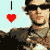Pixelated static image of a person wearing sunglasses and camouflage clothing with a red heart symbol on the left side against a light blue background.