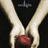 Animated sequence showing hands holding a red object, two people embracing, and four smaller scenes including a necklace, blood, a red ribbon, and a chess piece.