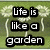 Pixelated dandelion icons on green grass background with black text reading 'Life is like a garden dig it and make it work keep on keepin on' in three