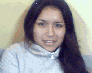 A person with long dark hair wears a light gray turtleneck sweater, shown in four sequential poses with varying head angles and expressions against a pale yellow background.