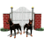 Animated sequence of two Doberman dogs standing before a brick wall and arched gate, with one dog shifting position across frames.