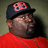 A person in a red shirt and black cap with pink 'BB' logo appears in four , showing slight head movement across frames