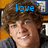 A pixelated image of a person with brown hair wearing a dark jacket, with blue text above the head changing from 'love' to 'him<3'.