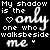 Black background with repeated white and blue text reading "My shadow is the only one who walks beside me" and small heart symbols.