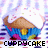 Pixelated icon of a blue cupcake with brown frosting and yellow filling, emitting purple and pink sparkles, with 'CUPPYCAKE' text below.