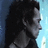 Pixelated profile view of a person with dark hair against blue and light blue background, static image.