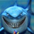 Pixelated static image of a cartoon shark with a wide grin, light blue body, and dark gray fins against a gradient blue background.