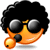 Animated orange emoji face with afro hair, dark sunglasses, and a small black microphone prop on its cheek.