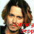 Pixelated image of a person with long brown hair and dark clothing, overlaid with red pixelated text in four sections.