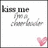 Pixelated icon with 'kiss me' text, a cartoon figure, and a pink heart on a white background.