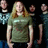 A pixelated static image shows a central figure with long light brown hair wearing a green shirt, flanked by two partial figures against a black background.